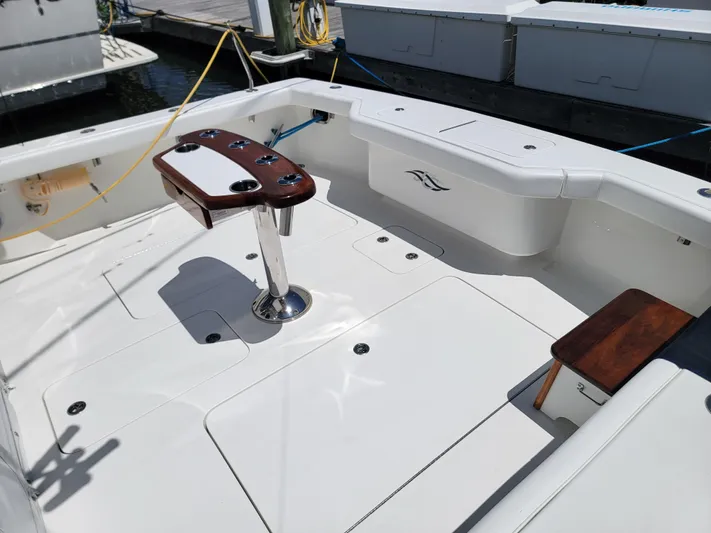  Yacht Photos Pics 2010 Jersey Cape Devil 36 boat deck with fishing rod holders and seating.