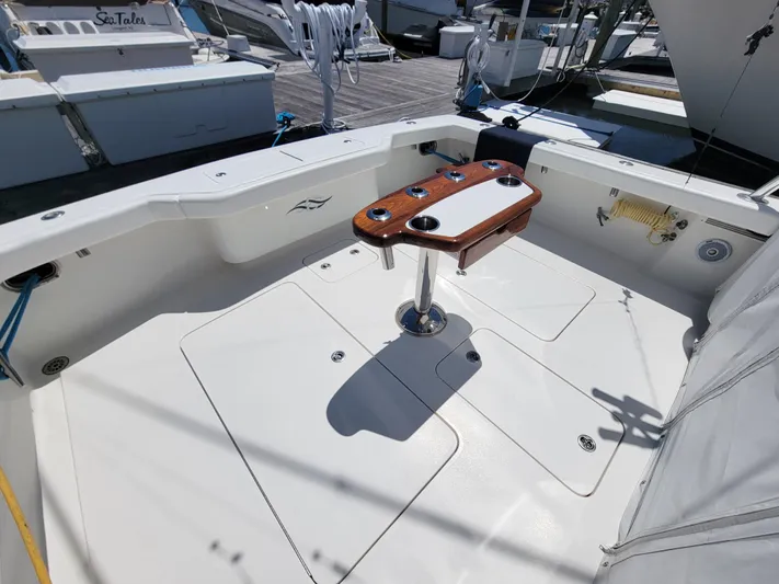  Yacht Photos Pics Jersey Cape Devil 36 2010 boat deck with fishing rod holders and clean white surface.