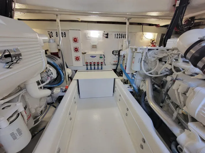  Yacht Photos Pics Engine room of a 2010 Jersey Cape Devil 36 boat with visible machinery and control panels.