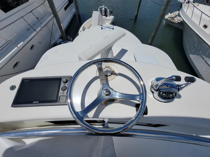  Yacht Photos Pics 2010 Jersey Cape Devil 36 boat helm with steering wheel and navigation controls.