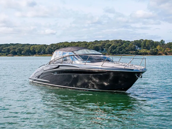 St Peter Yacht Photos Pics 2016 Riva 44 Rivarama Super yacht on serene water with lush green shoreline.