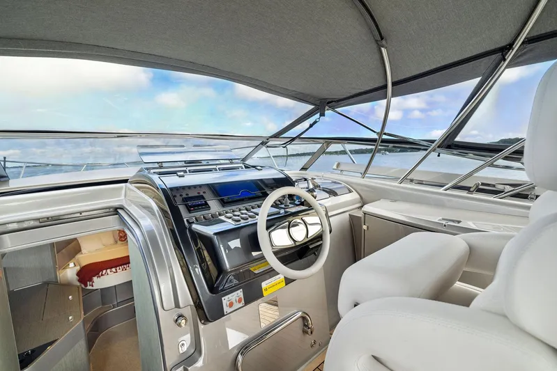 St Peter Yacht Photos Pics Interior of 2016 Riva 44 RIVARAMA SUPER yacht cockpit with modern controls and luxurious seating.