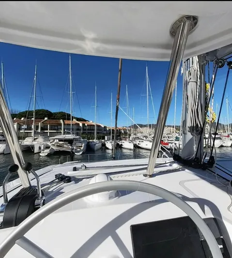  Yacht Photos Pics Modern Bali 4.4 yacht docked at marina, clear blue sky, 2023 model.