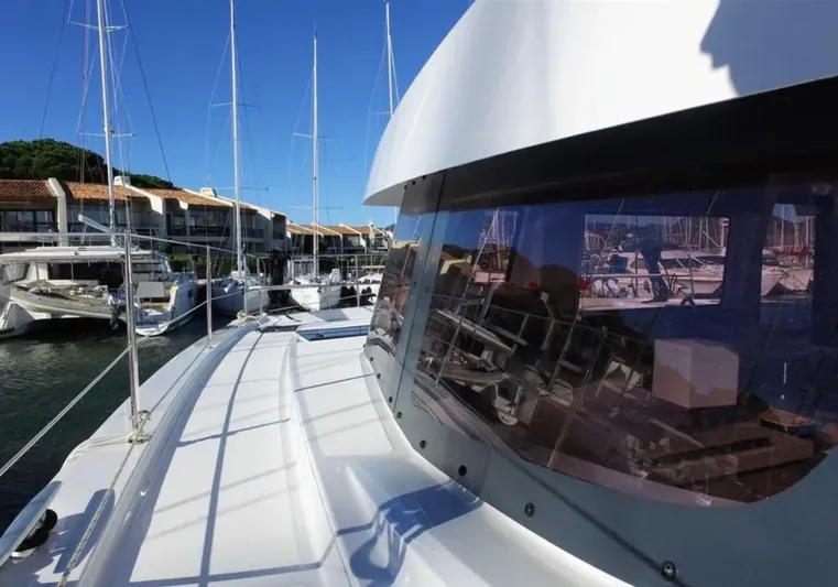  Yacht Photos Pics 2023 Bali 4.4 yacht docked at marina, showcasing sleek design and modern architecture.