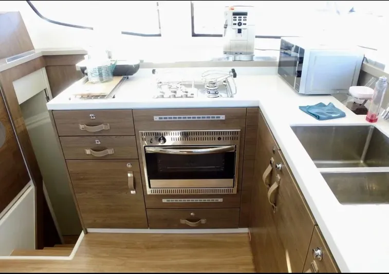  Yacht Photos Pics Modern kitchen in 2023 Bali 4.4 yacht with stove, oven, and sink.