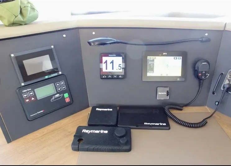  Yacht Photos Pics Control panel of a 2023 Bali 4.4 yacht with navigation and communication equipment.