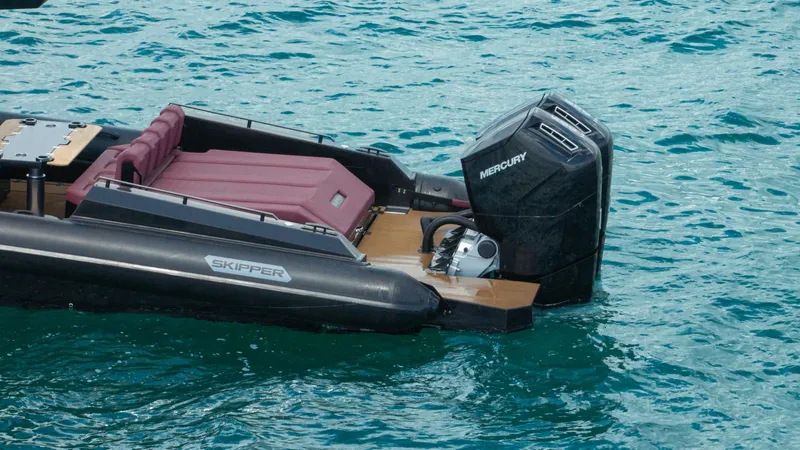  Yacht Photos Pics Skipper-BSK 42NC 2023 boat with Mercury engine on turquoise water.