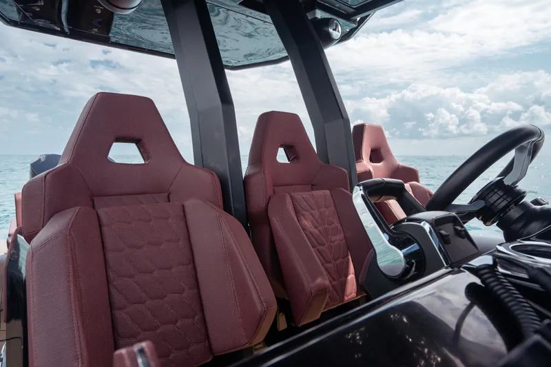  Yacht Photos Pics Luxurious Skipper-BSK 42NC boat interior with red seats, 2023 model, ocean view.