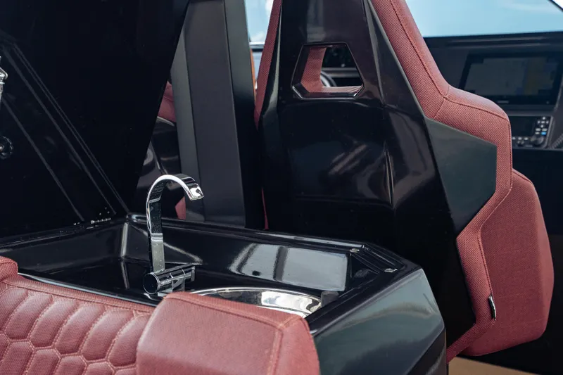  Yacht Photos Pics Luxury interior of 2023 Skipper-BSK 42NC boat with sleek sink and maroon seating.