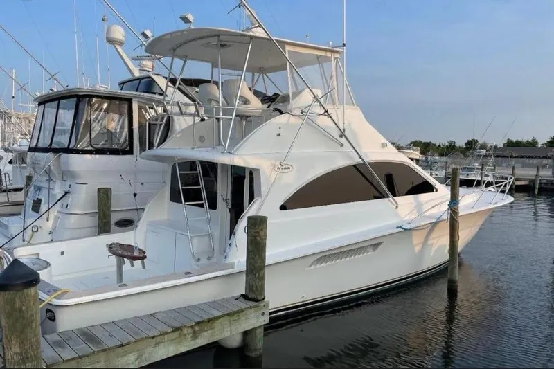 Trolling Fever Yacht Photos Pics 2005 Ocean Yachts 46 Super Sport docked at marina, side view.