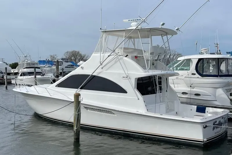 Trolling Fever Yacht Photos Pics 2005 Ocean Yachts 46 Super Sport docked at marina, showcasing sleek design and fishing capabilities.