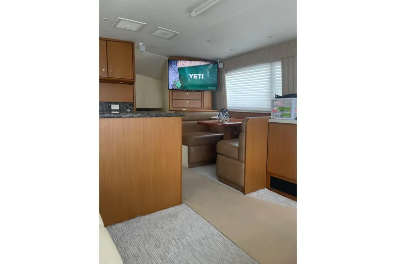 Trolling Fever Yacht Photos Pics Interior of 2005 Ocean Yachts 46 Super Sport with cozy dining area and TV.