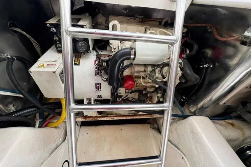 Trolling Fever Yacht Photos Pics Engine room of 2005 Ocean Yachts 46 Super Sport with visible generator and ladder.