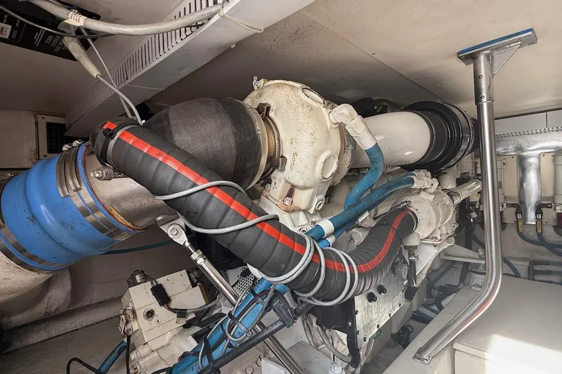 Trolling Fever Yacht Photos Pics Engine room of 2005 Ocean Yachts 46 Super Sport, showcasing complex machinery and piping.