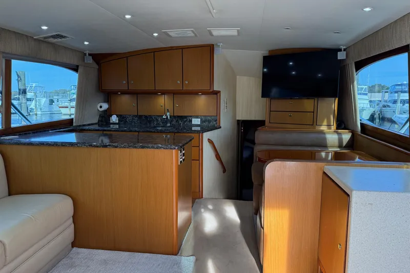 Trolling Fever Yacht Photos Pics Interior of 2005 Ocean Yachts 46 Super Sport with modern kitchen and seating area.