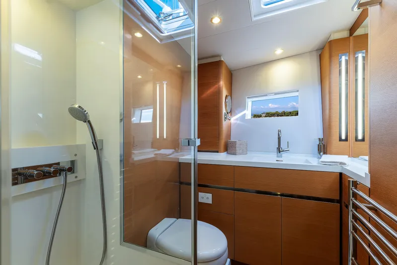 Cloudy Night Yacht Photos Pics Luxurious bathroom interior on 2019 CNB 76 yacht, featuring modern fixtures and natural lighting.