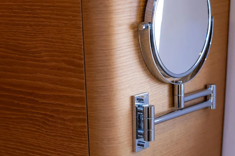 Cloudy Night Yacht Photos Pics Wall-mounted round mirror on wooden panel, CNB 76 yacht, 2019 model.