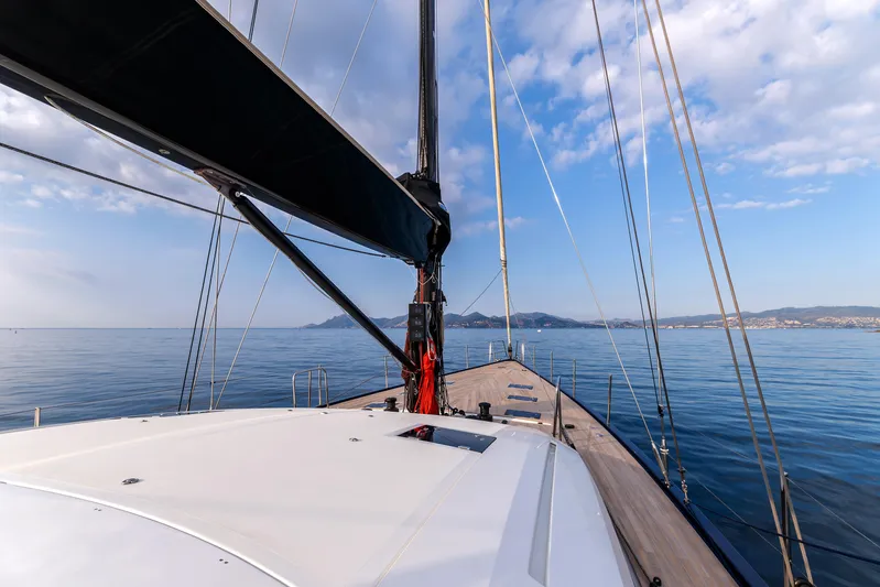Cloudy Night Yacht Photos Pics Sailing on a 2019 CNB 76 yacht with clear skies and calm waters.