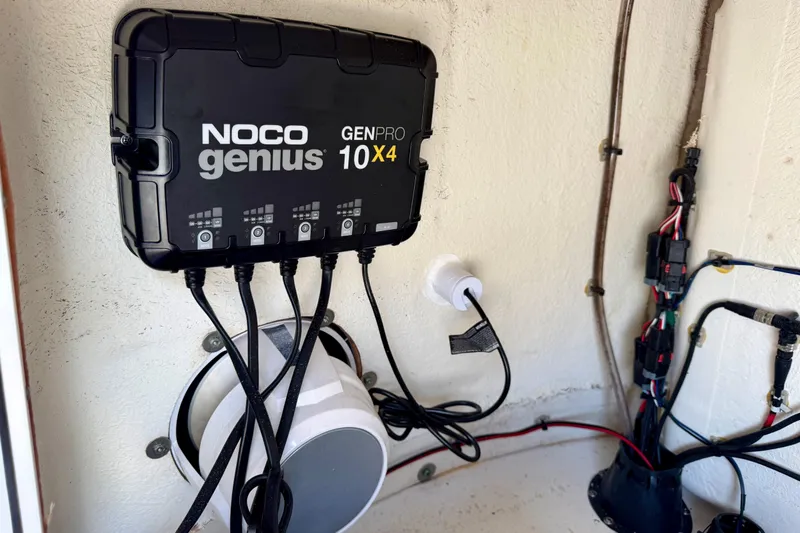  Yacht Photos Pics NOCO Genius GENPRO 10x4 charger installed on 2021 Sportsman Open 302 Center Console boat.