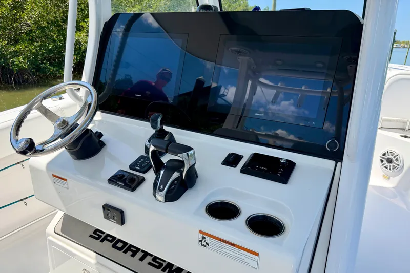  Yacht Photos Pics 2021 Sportsman Open 302 Center Console dashboard with steering wheel and controls.