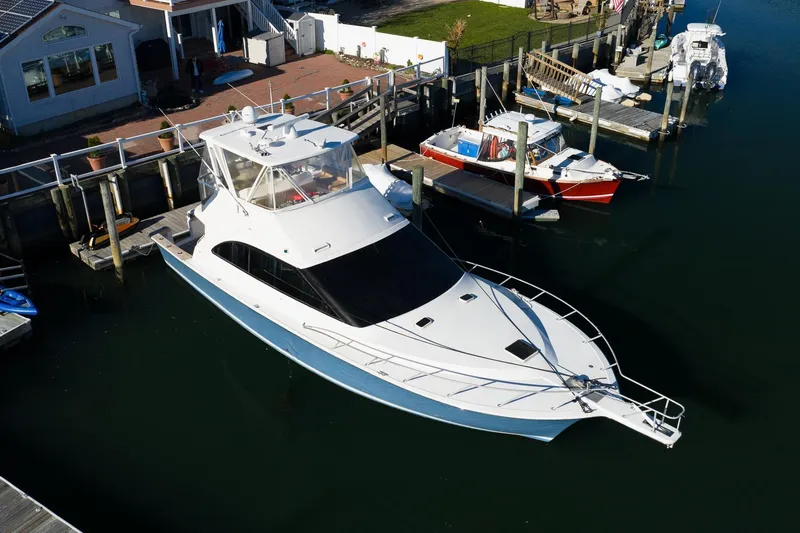Falcon Yacht Photos Pics 1998 Ocean Yachts 48 Super Sport docked at marina, aerial view.