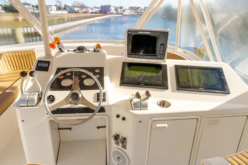 Falcon Yacht Photos Pics 1998 Ocean Yachts 48 Super Sport helm with navigation equipment and steering wheel.