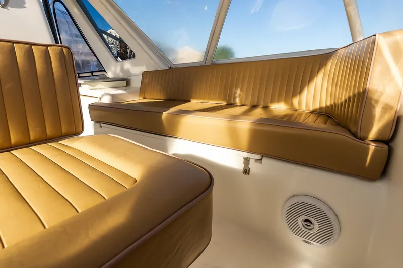 Falcon Yacht Photos Pics 1998 Ocean Yachts 48 Super Sport interior with tan leather seating and window views.