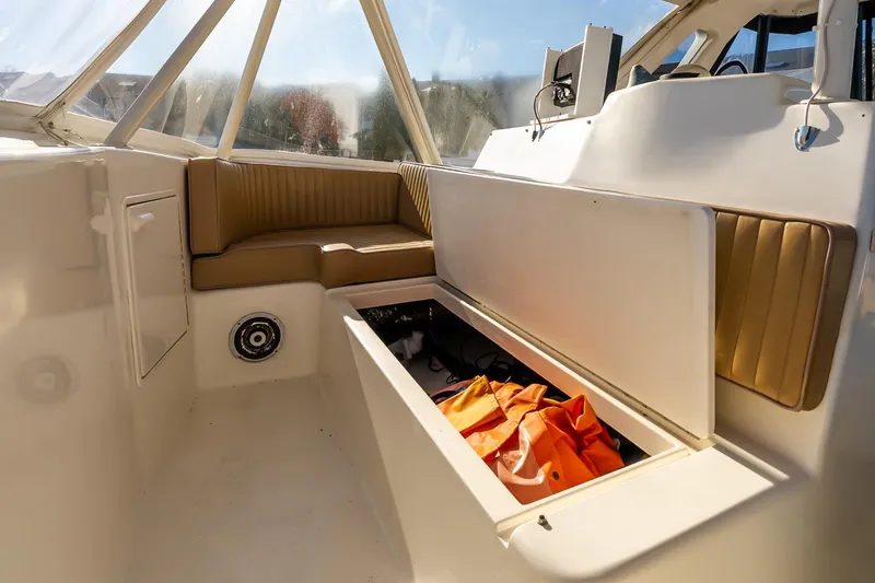 Falcon Yacht Photos Pics 1998 Ocean Yachts 48 Super Sport interior with seating and storage compartment.