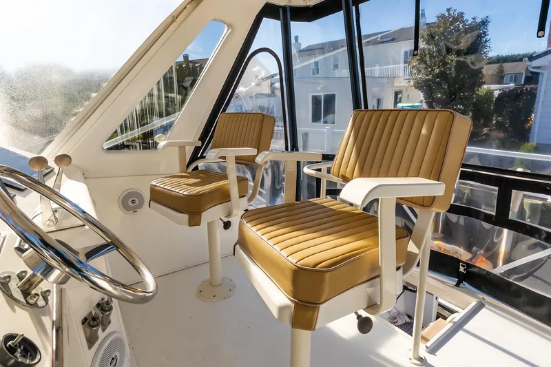 Falcon Yacht Photos Pics Interior of 1998 Ocean Yachts 48 Super Sport with helm and cushioned seats.