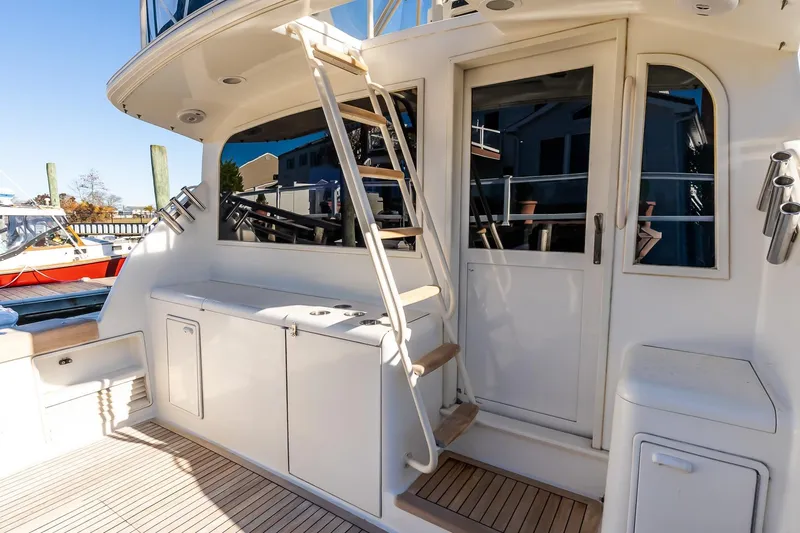 Falcon Yacht Photos Pics 1998 Ocean Yachts 48 Super Sport yacht deck with stairs and storage compartments.