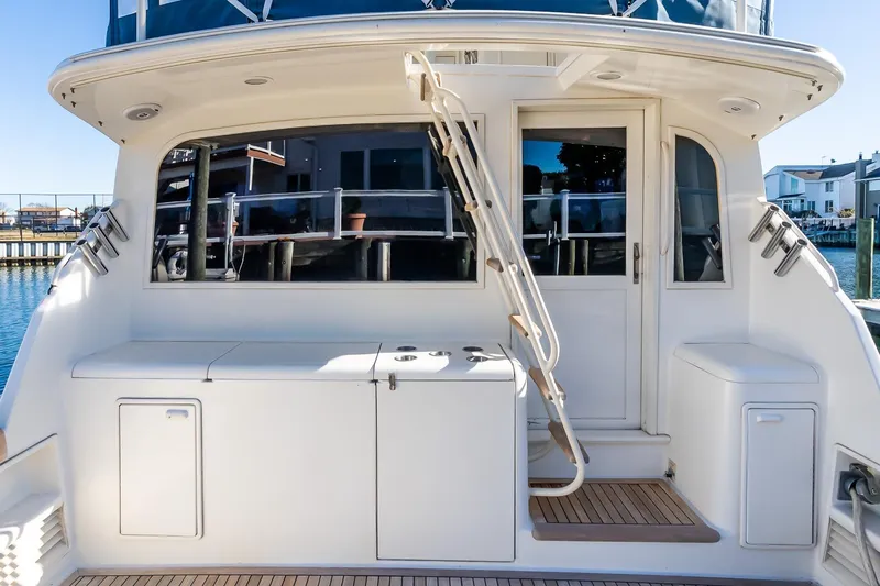 Falcon Yacht Photos Pics 1998 Ocean Yachts 48 Super Sport yacht deck with ladder and storage compartments.