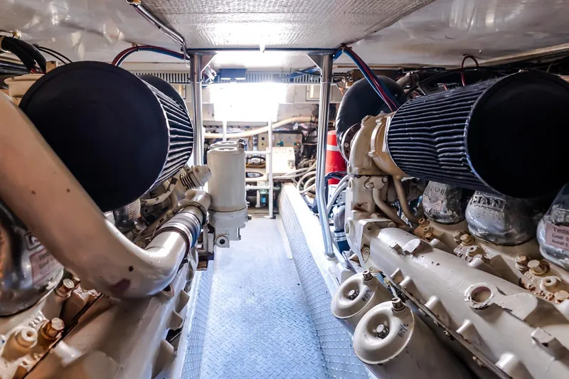 Falcon Yacht Photos Pics Engine room of 1998 Ocean Yachts 48 Super Sport, showcasing dual engines and mechanical components.