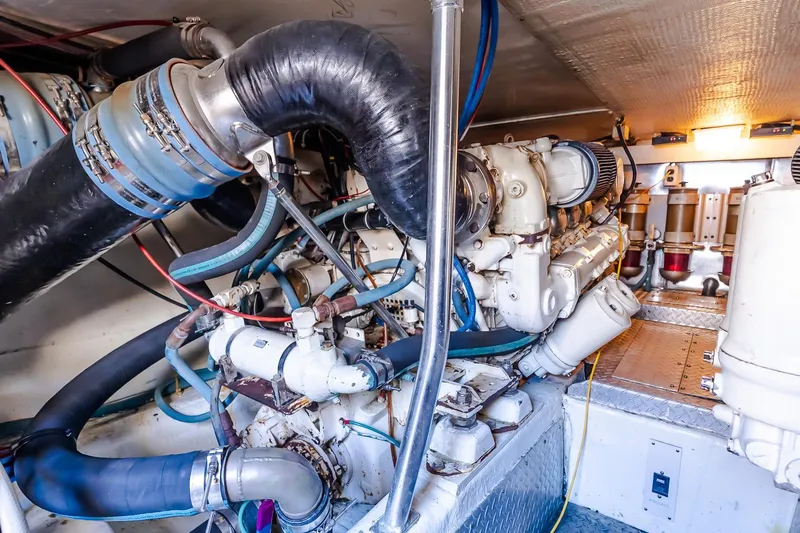 Falcon Yacht Photos Pics Engine room of 1998 Ocean Yachts 48 Super Sport, showcasing complex machinery and components.