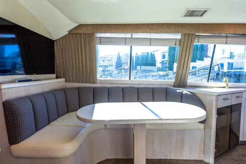 Falcon Yacht Photos Pics Interior of 1998 Ocean Yachts 48 Super Sport with dining area and large windows.