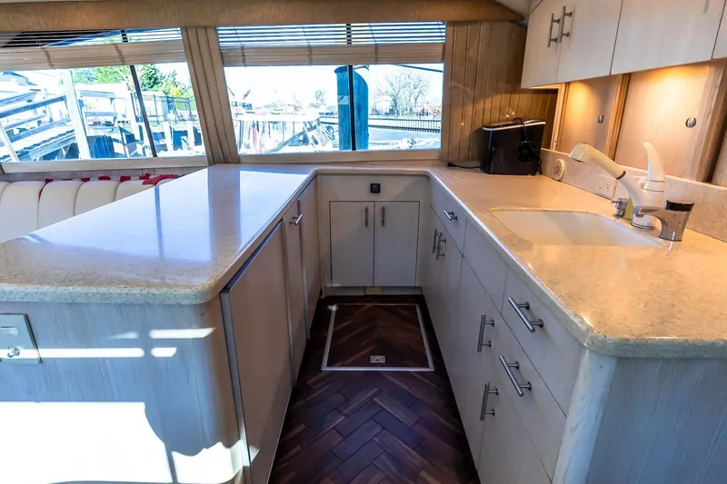 Falcon Yacht Photos Pics Luxurious kitchen interior of 1998 Ocean Yachts 48 Super Sport with modern amenities.