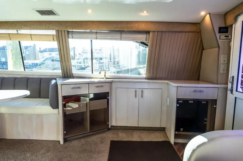 Falcon Yacht Photos Pics Luxurious interior of 1998 Ocean Yachts 48 Super Sport with modern cabinetry and seating.