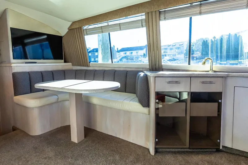 Falcon Yacht Photos Pics Interior of 1998 Ocean Yachts 48 Super Sport with dining area and kitchenette.