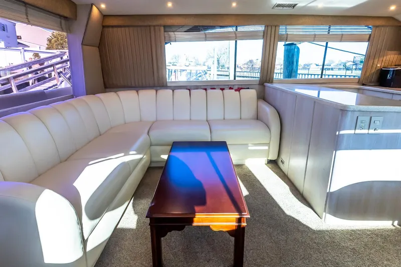 Falcon Yacht Photos Pics Luxurious interior of 1998 Ocean Yachts 48 Super Sport with plush seating and elegant table.