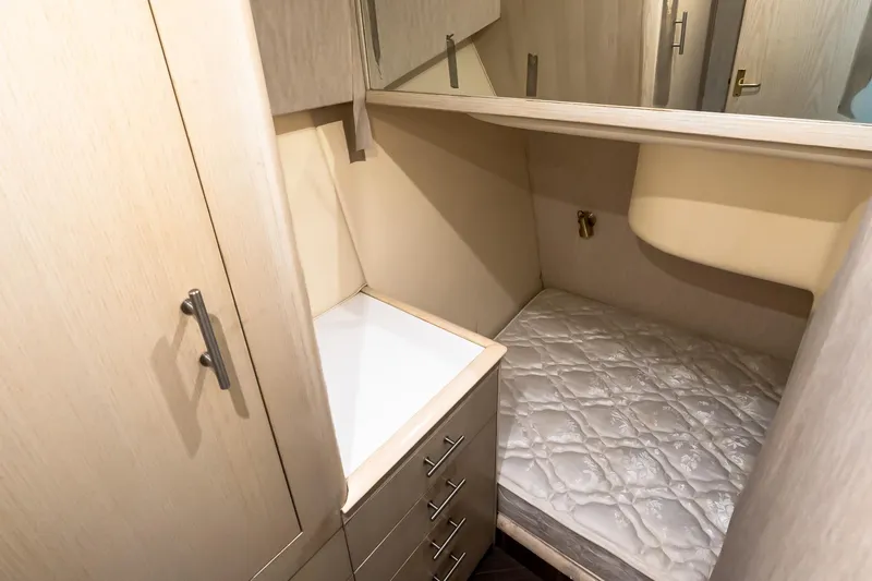 Falcon Yacht Photos Pics 1998 Ocean Yachts 48 Super Sport cabin with bed, storage, and light wood finish.