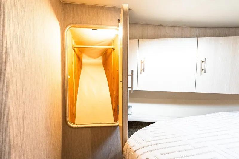 Falcon Yacht Photos Pics Interior of 1998 Ocean Yachts 48 Super Sport, featuring a cozy cabin closet.