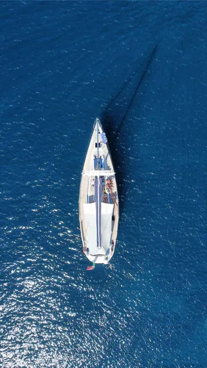  Yacht Photos Pics Aerial view of 1999 Nautor Swan 56 yacht sailing on deep blue ocean.