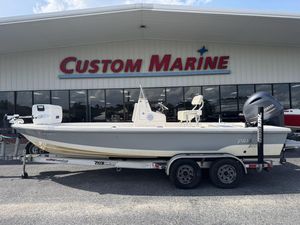 2014 Pathfinder 2200 TRS boat on trailer at Custom Marine dealership.