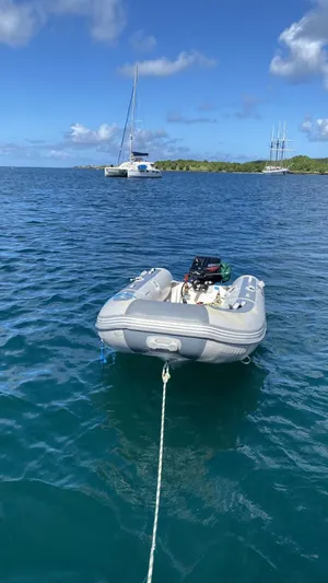  Yacht Photos Pics Inflatable boat on calm sea with Bali 4.0 catamaran in the background, 2017 model.