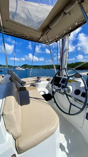  Yacht Photos Pics Steering area of a 2017 Bali 4.0 yacht with scenic ocean view.