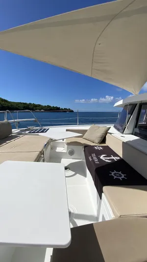  Yacht Photos Pics Luxurious Bali 4.0 yacht deck with seating, table, and ocean view, 2017 model.