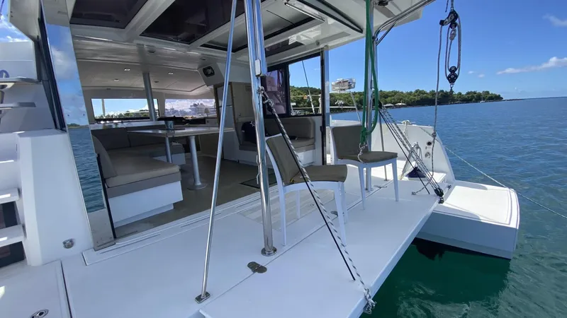  Yacht Photos Pics Bali 4.0 catamaran interior with seating, open deck, and ocean view, 2017 model.