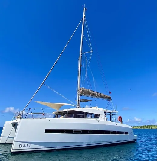  Yacht Photos Pics Sailing catamaran Bali 4.0, 2017 model, anchored in clear blue waters.