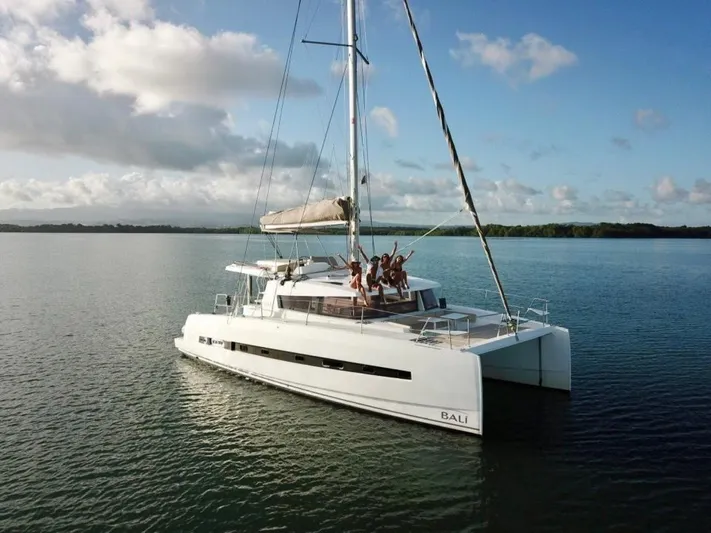  Yacht Photos Pics 2017 Bali 4.0 catamaran sailing on calm waters with people enjoying the deck.