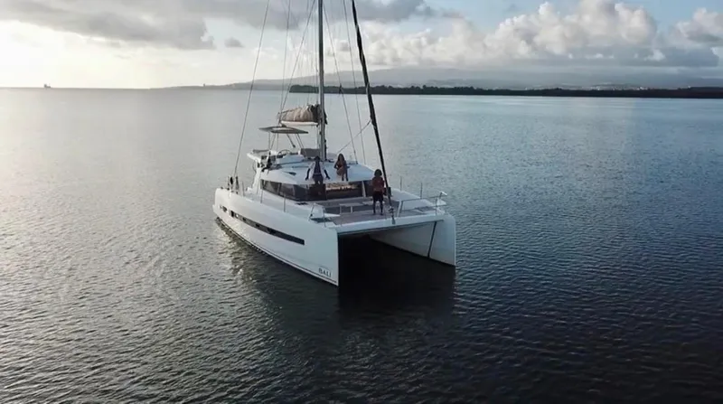  Yacht Photos Pics 2017 Bali 4.0 catamaran sailing on calm waters under a cloudy sky.