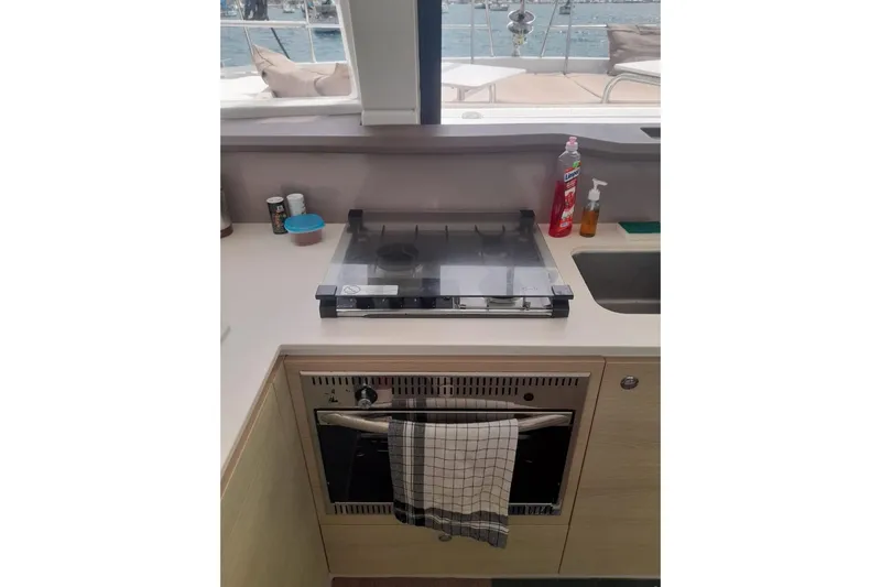  Yacht Photos Pics Compact kitchen area on a 2017 Bali 4.0 yacht with stove and oven.